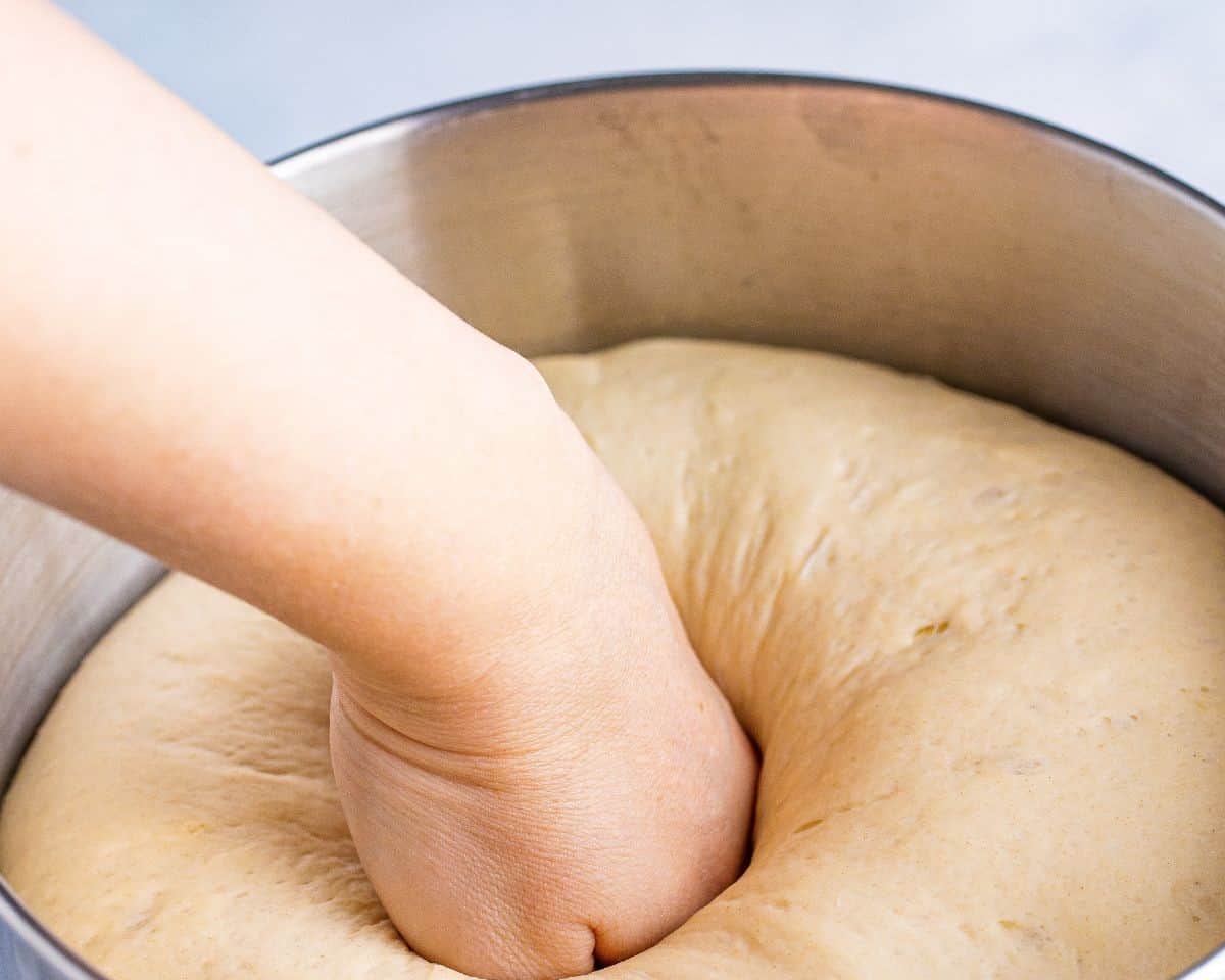 Punching down the dough.