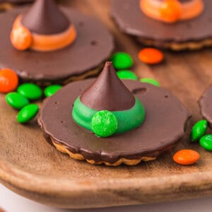 Witch hat cookies on a wooden plate