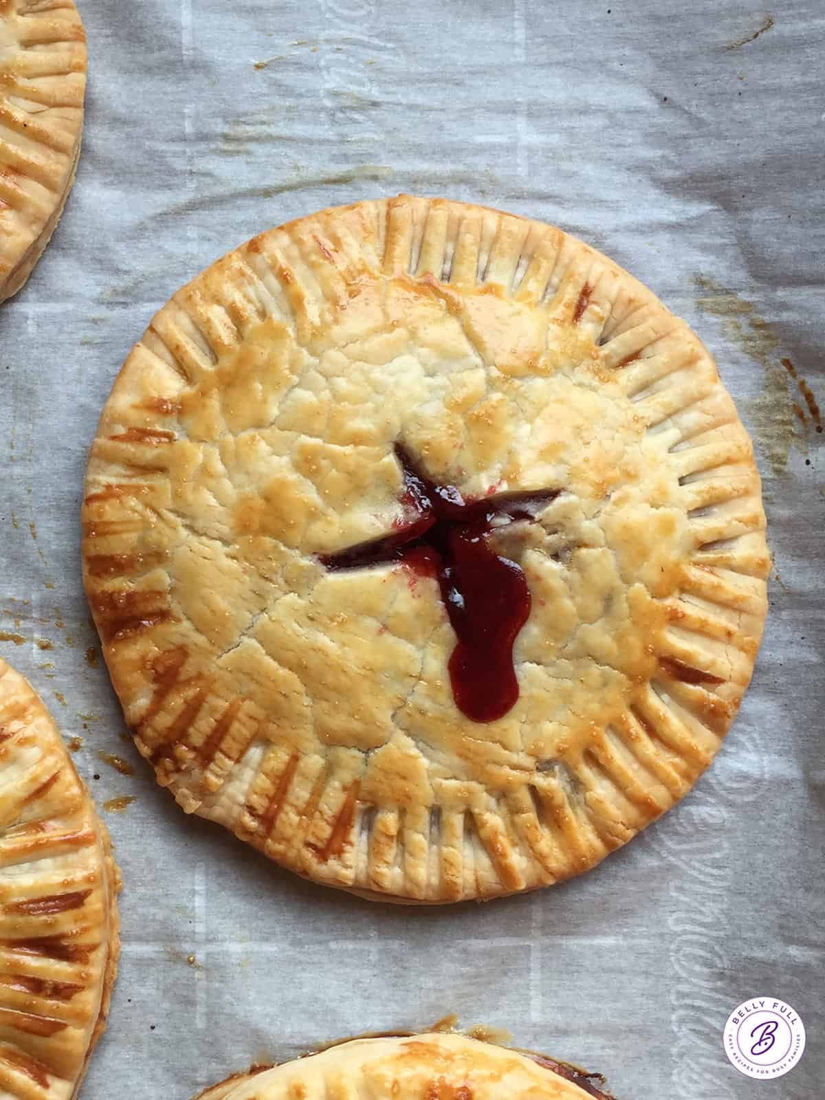 overhead cranberry hand pie on parchment paper