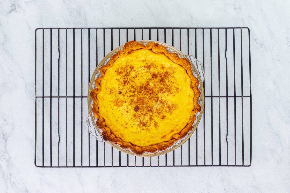 Baked pie on a cooling rack.