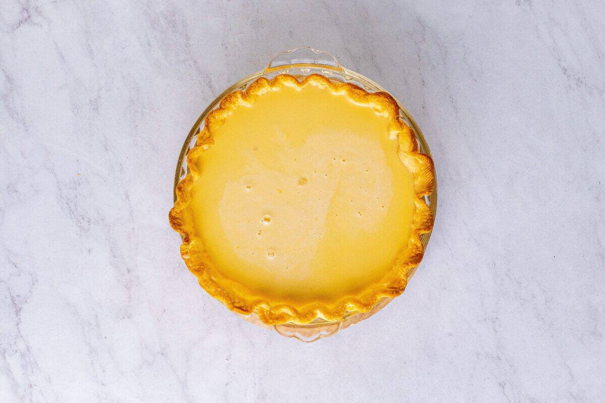 Filling in the baked pie crust.