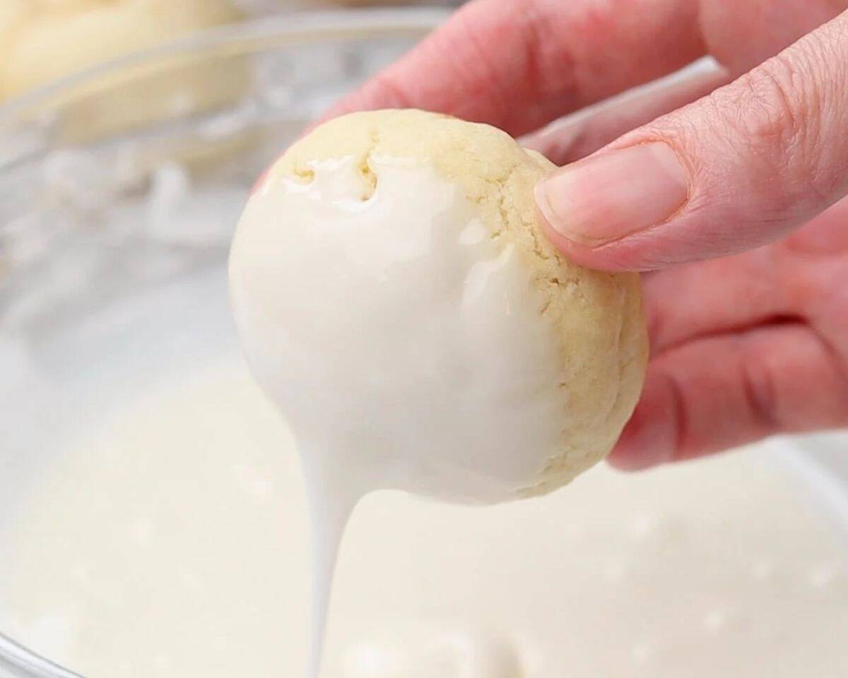 Dipping cookies in the icing. 