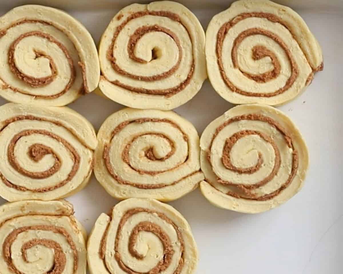 Pillsbury cinnamon rolls in a baking pan.