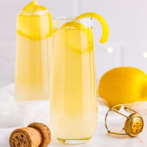 A French 75 garnished with a lemon twist