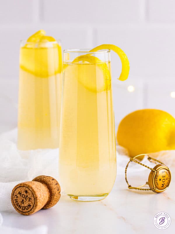 A French 75 garnished with a lemon twist