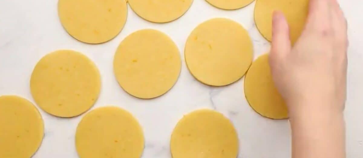 Rolling the dough into 3" circles. 