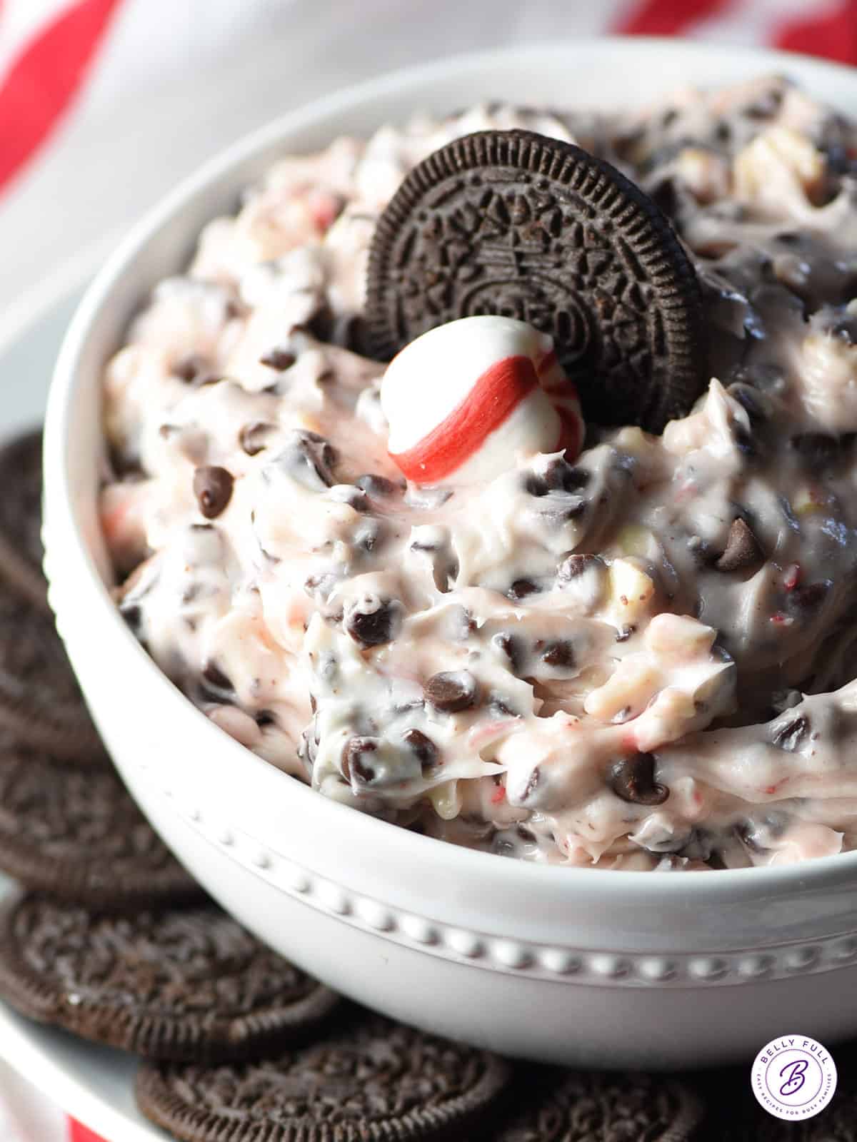 chocolate chip peppermint dip in bowl garnished with oreo