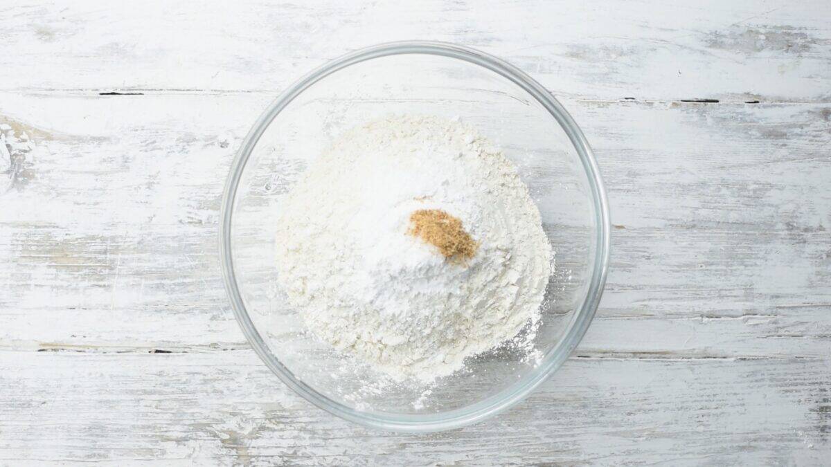 Combining the dry ingredients in a glass bowl.