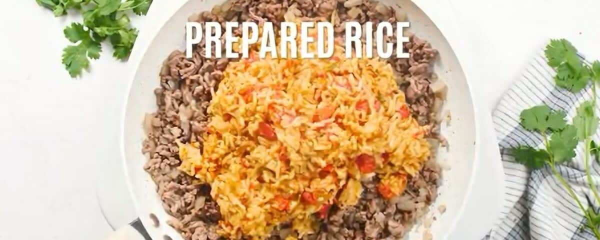 Combining the ground beef and rice. 