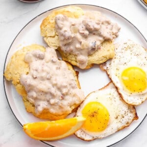 2 biscuits with sausage gravy and 2 fried eggs