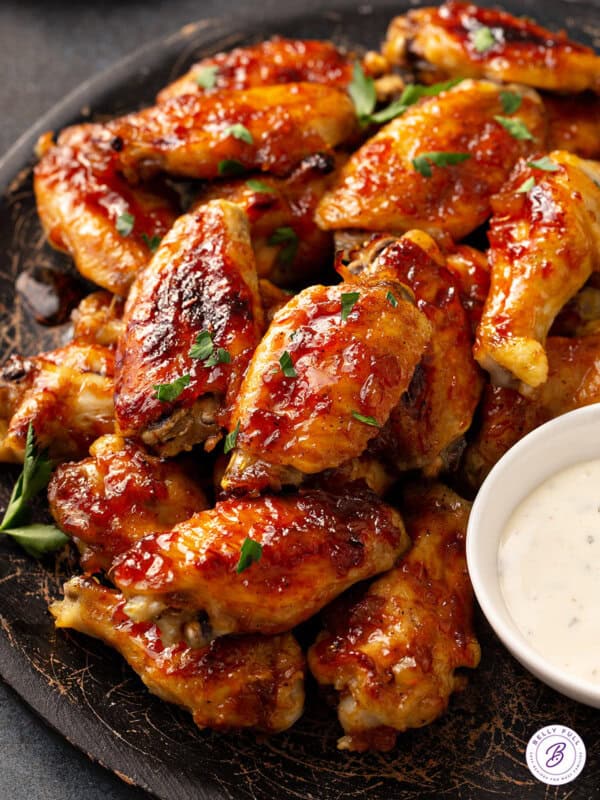 overhead plate of baked chicken wings basted in pineapple Caribbean sauce