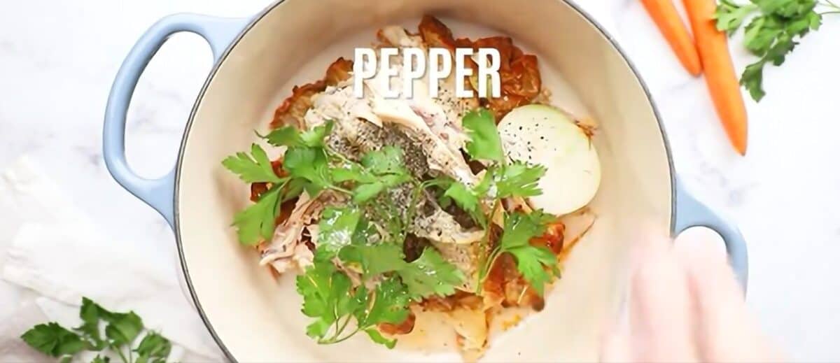 Placing all the ingredients to make the soup broth in a Dutch oven. 