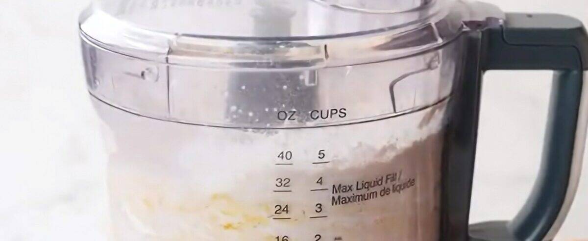 Ingredients to make the dumpling dough in a food processor. 