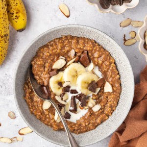 overhead chocolate-y steel cut oatmeal in bowl with bananas