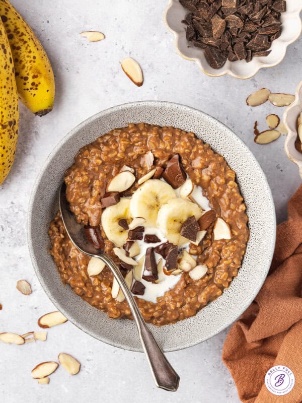 overhead chocolate-y steel cut oatmeal in bowl with bananas