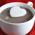 heart shaped marshmallow floating in hot cocoa