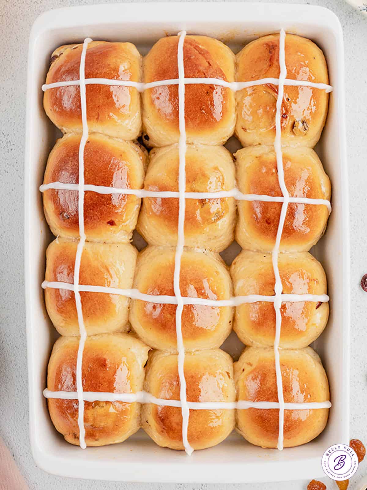 Overhead view of a pan of hot cross buns