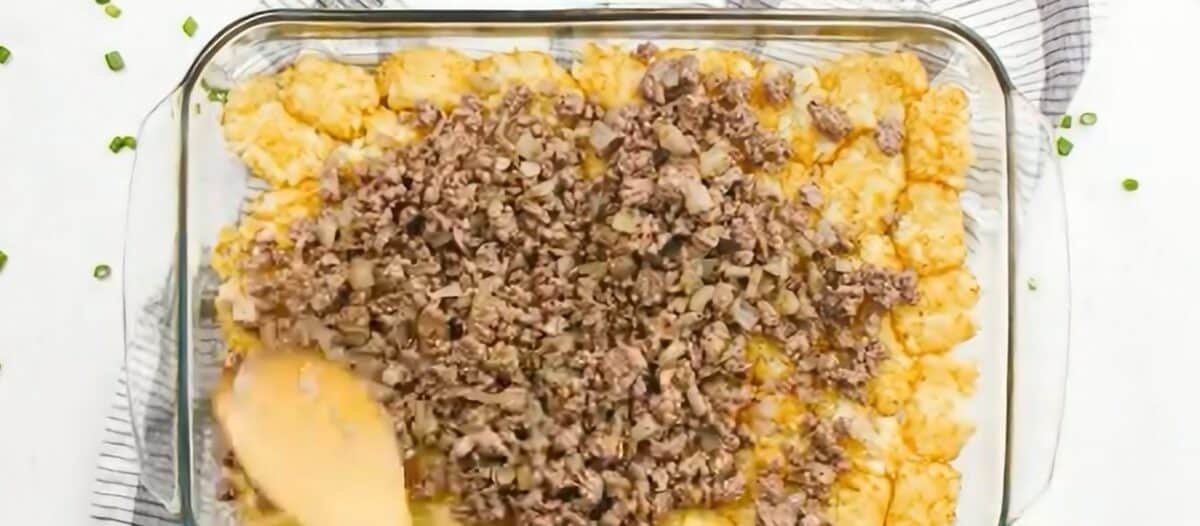 Layering the casserole in the baking dish.