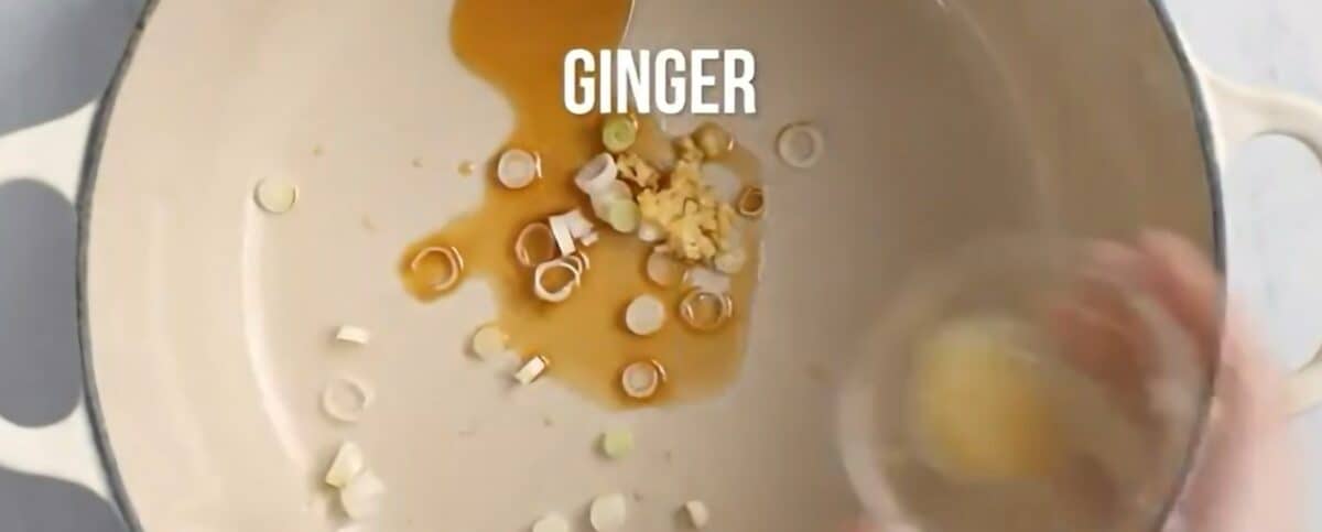 Cooking the garlic and ginger in the pot.