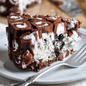 Slice of creamy Oreo Swiss Roll Cake