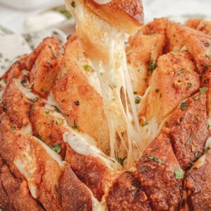 boule sourdough bread loaf with cheese pull