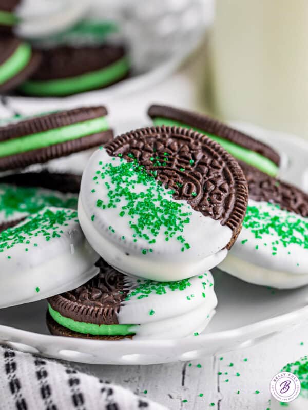white chocolate coated mint oreos with green sanding sugar