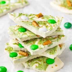 Stack of St. Patrick's Day white chocolate bark with pretzels and green M&Ms
