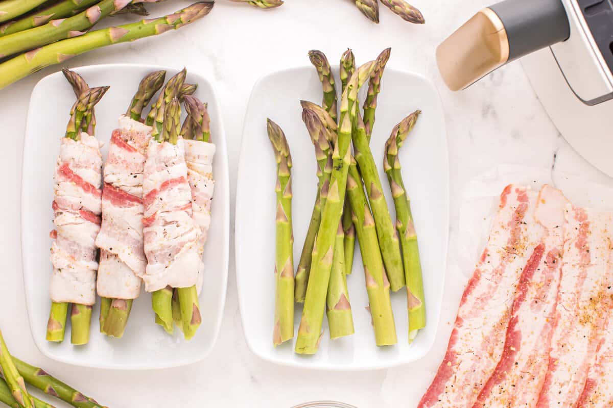 A plate of bacon wrapped asparagus, a plate of asparagus, and a plate of bacon.