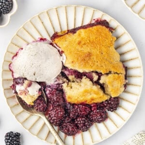 overhead plate of blackberry cobbler with ice cream