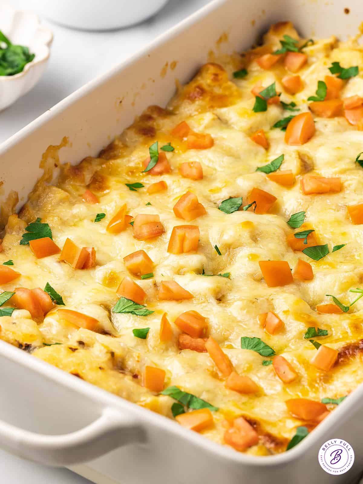 Overhead view of chicken alfredo bubble pizza in a casserole dish