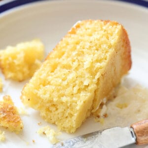 piece of corncake on plate with butter knife