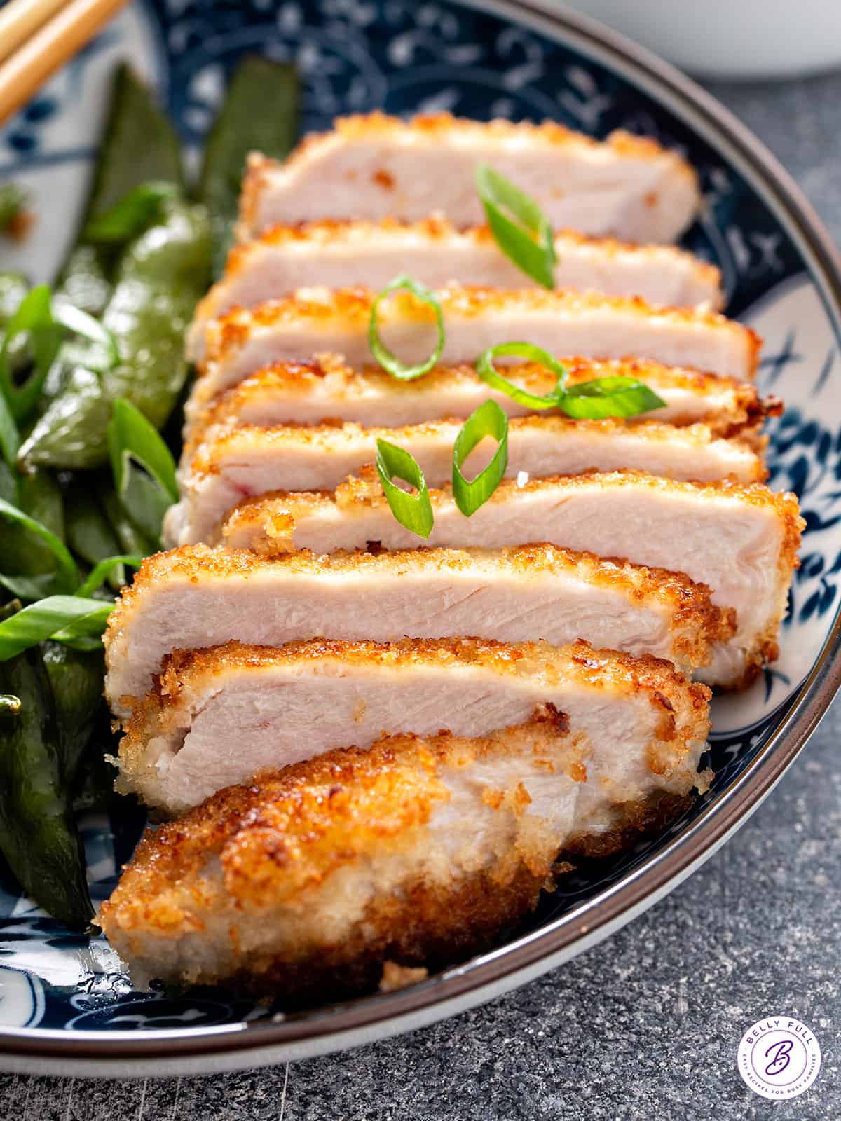 sliced panko-crusted pork chop on plate