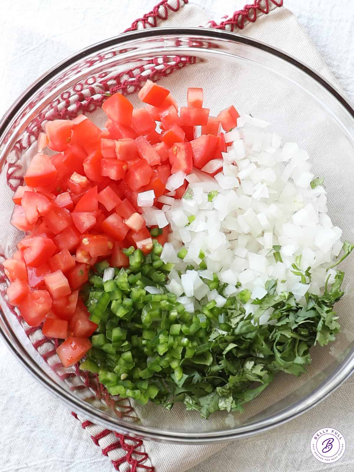 diced tomatoes, onion, jalapenos, and cilantro in bowl