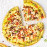 pita breakfast pizza sliced into 4 wedges