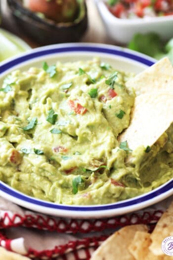 bowl of guacamole with tortilla chips