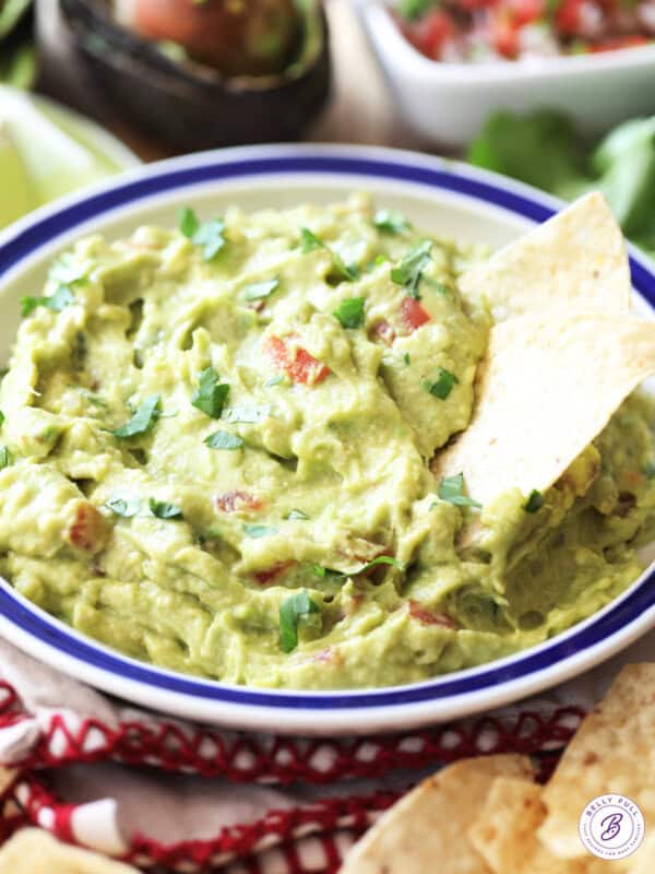 bowl of guacamole with tortilla chips