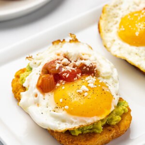 hash brown avocado toast with fried egg and salsa