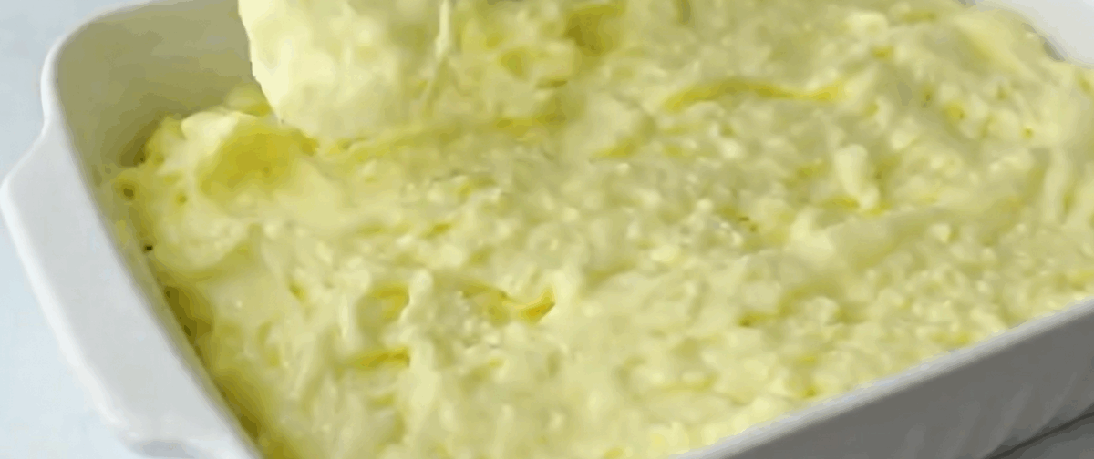 Pouring the cake batter into the pan.