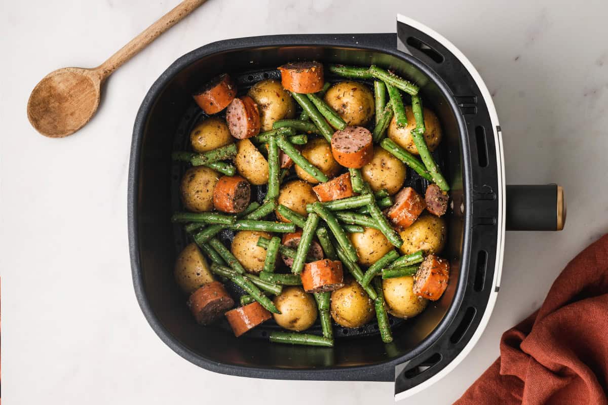 Seasoned kielbasa and veggies in the air fryer.