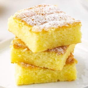 2 lemon bars stacked on white plate