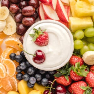 overhead fruit dip surrounded by cut fresh fruit