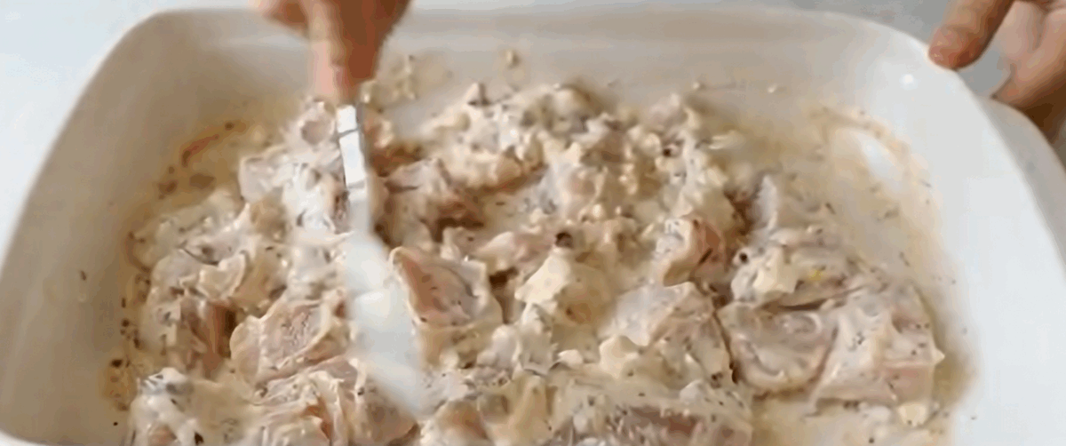 Marinating the chicken.