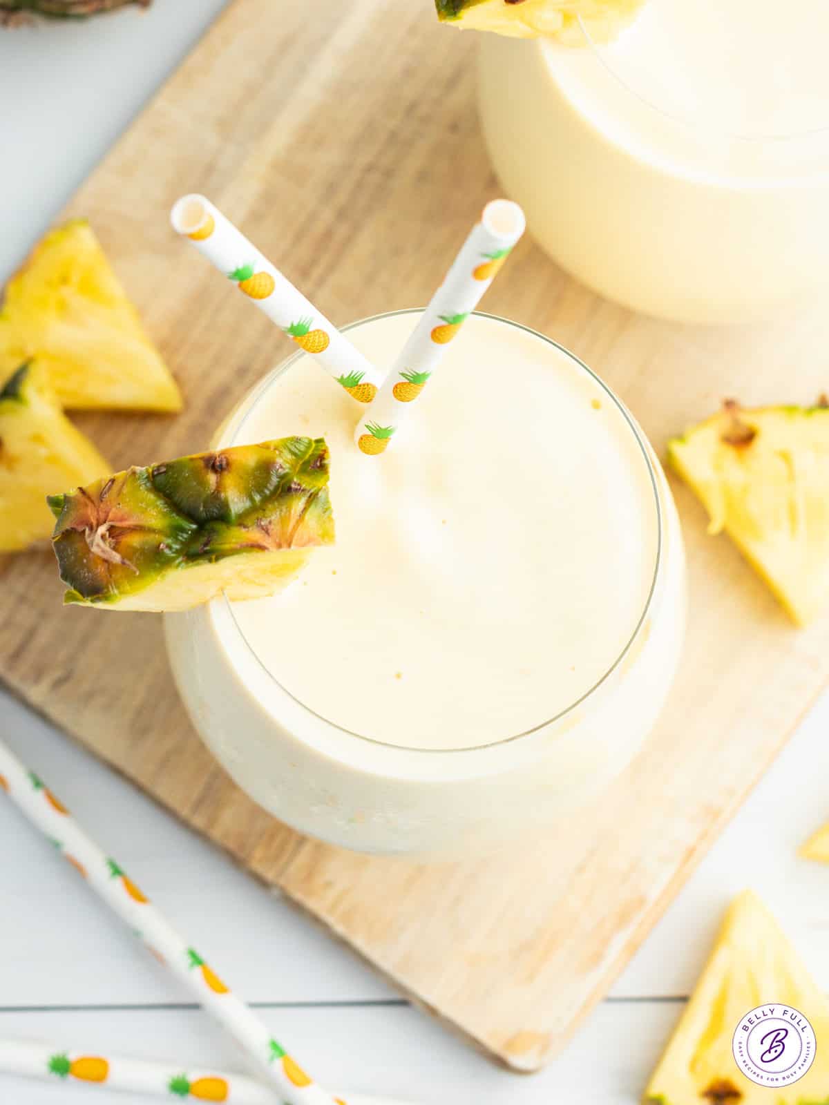 overhead smoothie with pineapple wedge garnish