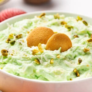 Nilla wafers in a bowl of pistachio pineapple dip