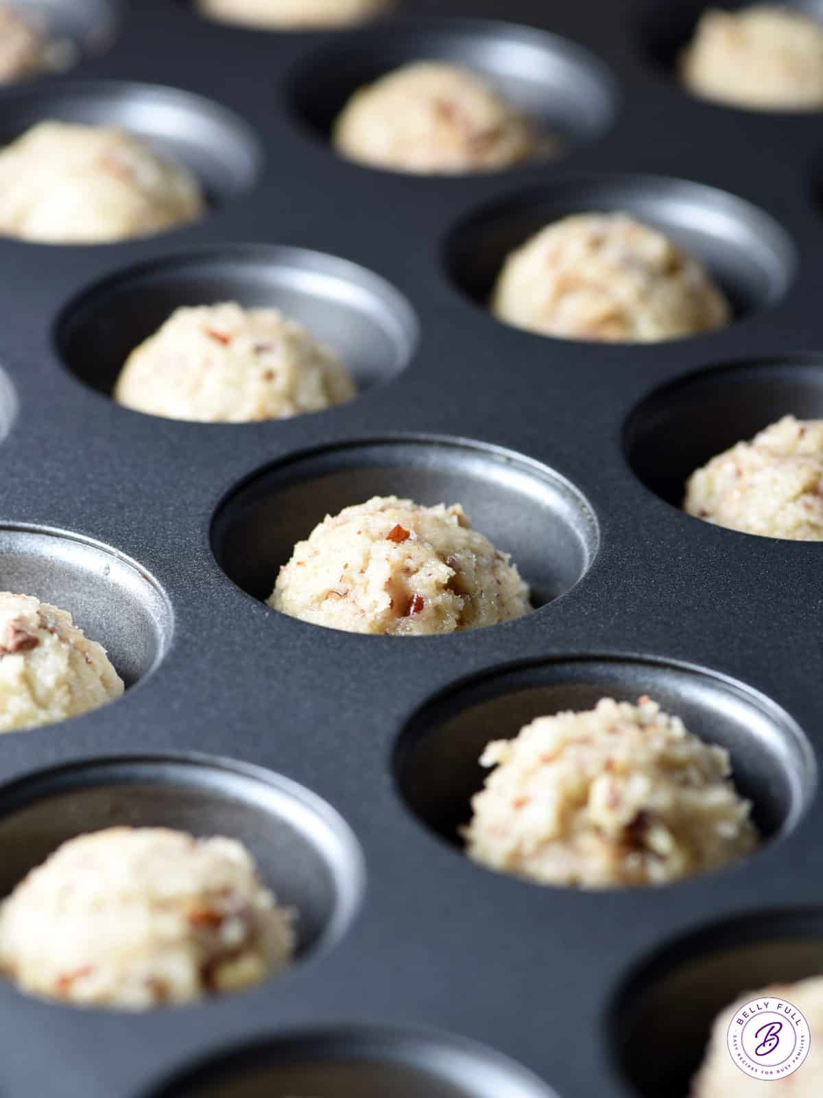 pecan sugar cookie dough in mini muffin tin