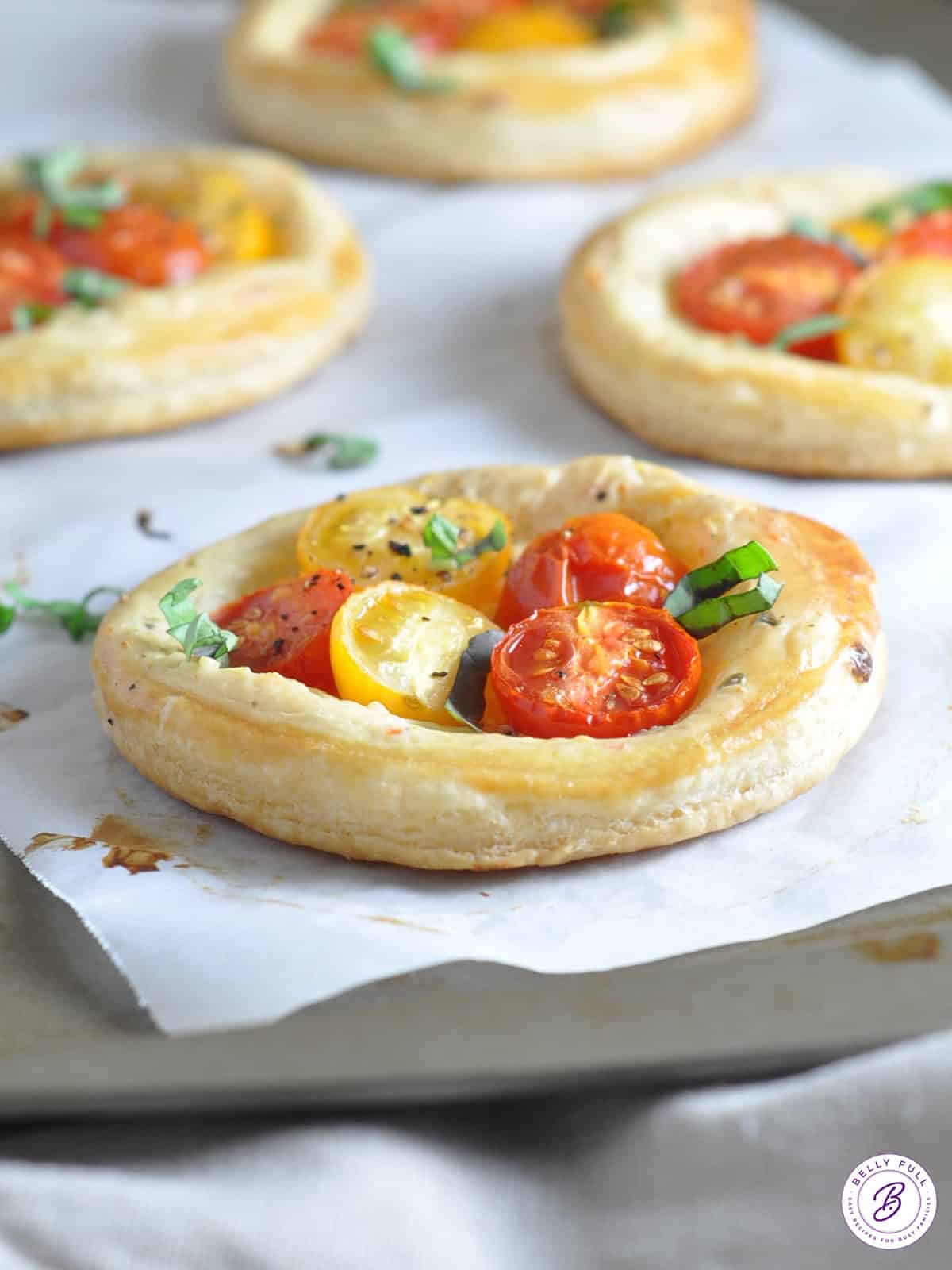 golden puff pastry with roasted halved cherry tomatoes