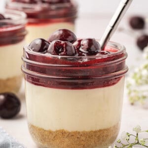A cherry cheesecake in a jar