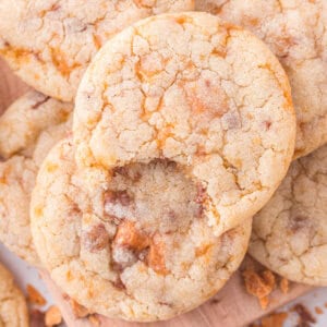 Overhead view of butterfinger pudding cookies, with a bite missing