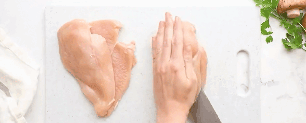 Cutting the chicken into cutlets. 