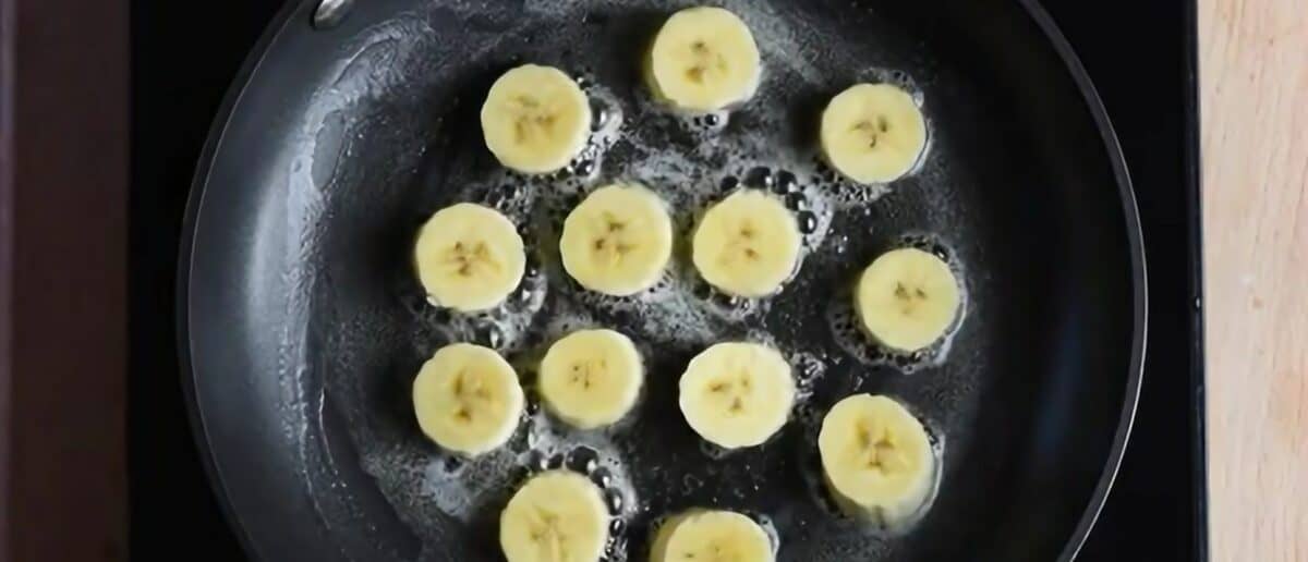 Frying banana chunks in butter.